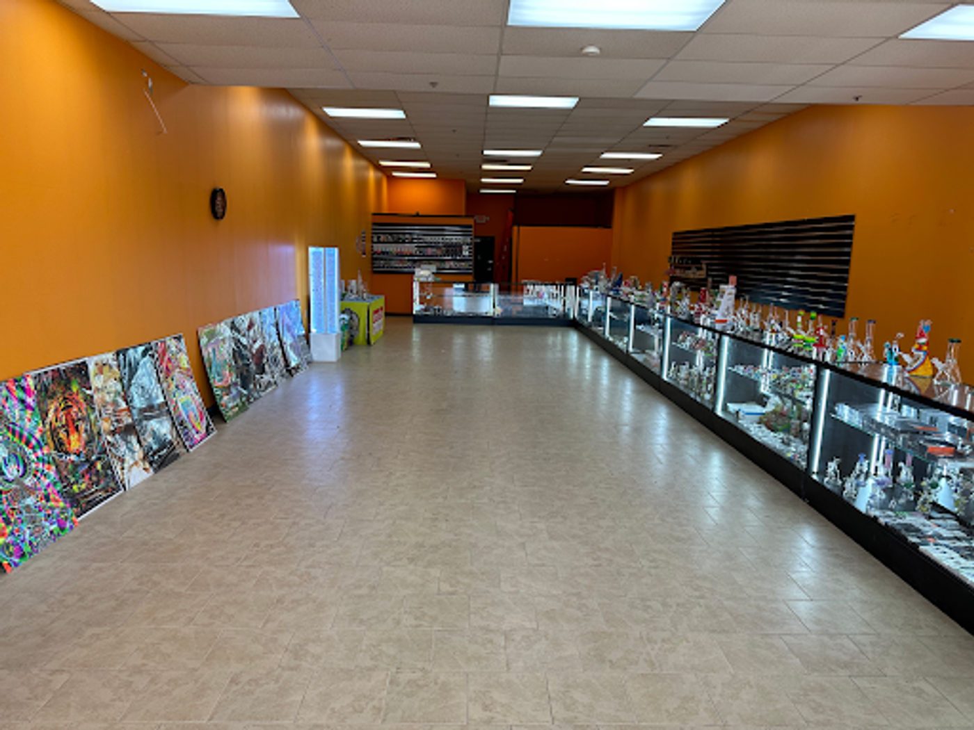 Long shop floor lined with glass display cases
